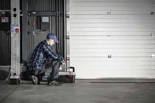 Commercial door installer hard at work